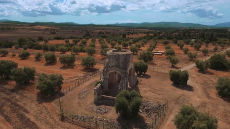 Old-medieval-monastery-abbey-church-Abbazia-di-San-Bruzio,-a-damaged-abandoned-ruin-in-Tuscany-from-the-11th-century-Middle-Ages-surrounded-by-olive-trees-in-Italy