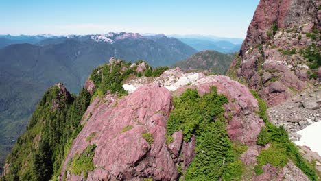 Aerial-Rotation-Right-of-HIker-on-a-Summit---Mackenzie-Range,-Vancouver-Island,-BC,-Canada