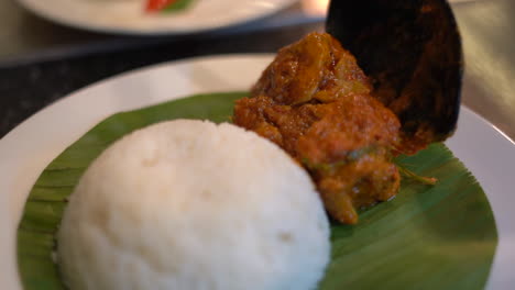 Bowel-of-rice-plating-on-banana-leaf-eggs-and-curry-dish-South-Indian-food-2