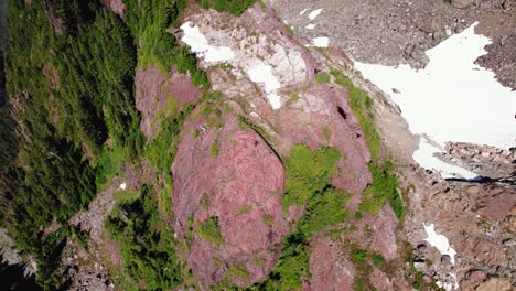 Far-Aerial-Sprial-Down-Shot-of-Hiker-on-a-Peak---Mackenzie-Range,-Vancouver-Island,-BC,-Canada