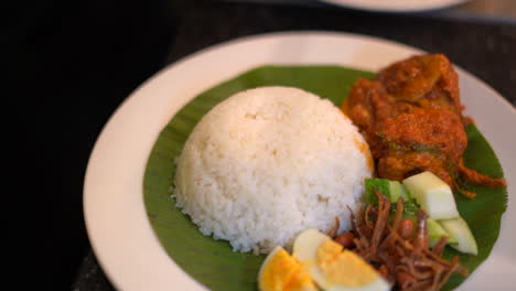 Bowel-of-rice-plating-on-banana-leaf-eggs-and-curry-dish-South-Indian-food-1