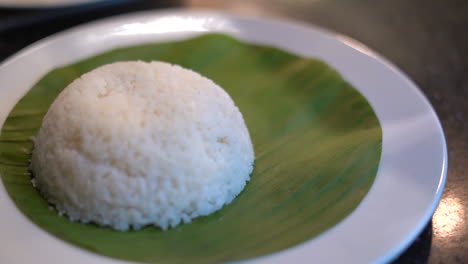 Bowel-of-rice-plating-on-banana-leaf-eggs-and-curry-dish-South-Indian-food