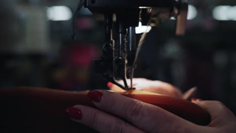 Worker-sewing-the-sole-of-a-shoe-slow-motion