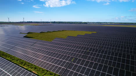 Solar-Panels-And-Wind-Turbines-In-Rural-Fields-On-Sunny-Day
