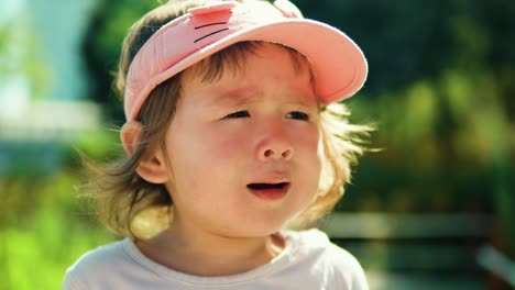 Displeased-toddler-girl-crying-outdoor---portrait-slow-motion