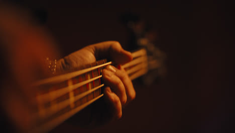 Close-up-of-fingers-playing-bass-guitar-2