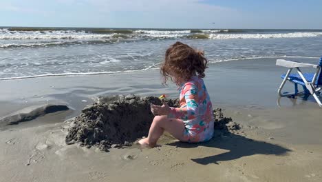 Toddler-building-sand-castle-at-beach-Kiawah-Island-South-Carolina