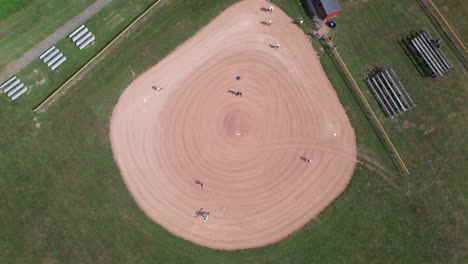 Top-down-aerial-view-softball-field-or-diamond-with-people-playing-sport