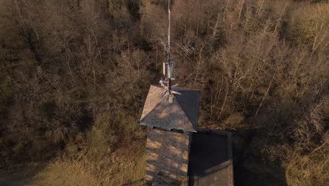 Aerial-Revealing-Shot-Of-The-Wetzlar-Tower-With-A-Large-Communication-Tower-Beside