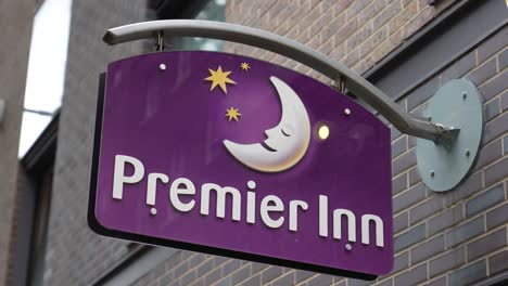 London-England-September-2022-Establishing-shot-a-Premier-Inn-sign-hanging-from-hotel