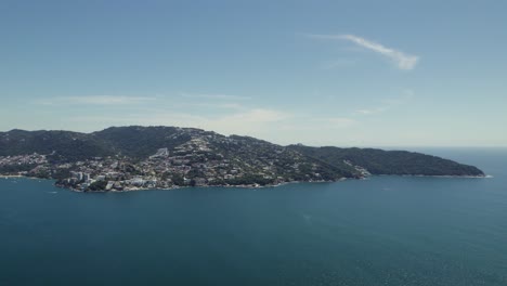 Beautiful-Mexico-Coastline-of-Acapulco-on-Sunny-Summer-Day,-Aerial-With-Copy-Space-in-Blue-Sky