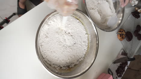 Pastry-Chef-Adding-And-Mixing-Flour-Into-Dough-Mixture