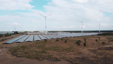 Green-energy-farm-with-wind-turbines-and-solar-panels