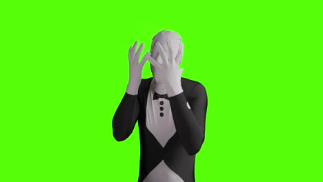 Static-shot-of-angry-business-morphsuit-getting-desperate-and-depressed-while-gesticulating-against-green-background