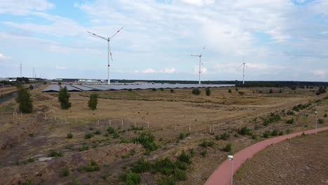 Wind-turbine-and-solar-panel-farm-in-Lommel,-Belgium