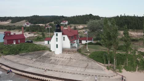 Historic-Point-Betsie-Lighthouse-in-Frankfort,-Michigan-located-along-Lake-Michigan-with-drone-video-close-up-moving-sideways
