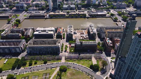 Panning-up-drone-shot-of-Buenos-Aires,-Argentina-from-Puerto-Madero-on-a-clear,-sunny-day