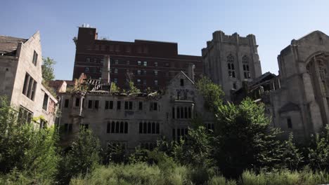 Abandoned-historic-City-Methodist-Church-in-Gary,-Indiana-with-gimbal-video-wide-shot-on-the-side-panning-left-to-right