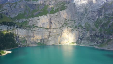 Slow-Ascending-Aerial-Shot-Of-Oeschinen-Lake-On-A-Beautiful-Summers-Day