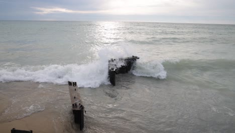 Waves-crashing-on-breakers-in-Lake,-Michigan-located-in-Frankfort,-Michigan-with-stable-wide-shot-video