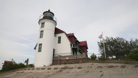 Historic-Point-Betsie-Lighthouse-in-Frankfort,-Michigan-along-Lake-Michigan-with-gimbal-video-walking-sideways