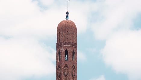 Mid-shot-for-the-man-on-the-top-of-the-minaret-finish-it-without-any-PPE
