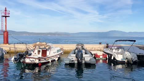 Marina-with-boats-pier-and-lighthouse-near-Malinska-Krk-Croatia-1
