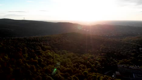 Aerial-drone-forward-footage-on-Buda-hills,-sunrise