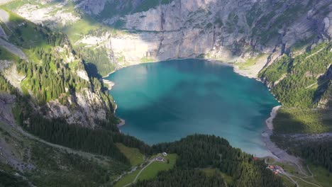 Aerial-of-Blümisalp-Mountain-and-the-Oeschinen-lake,-drone-reveal-stunning-altitude-lake-in-mountains-Switzerland-alps