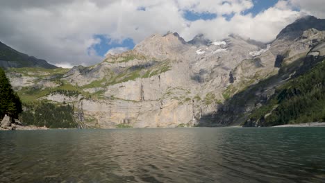 Landscape-panoramic-view-of-the-Blümisalp-Mountain-and-the-Oeschinen-lake,-ripple-water-and-Rocky-Mountains-peak