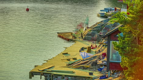 Static-shot-over-a-wooden-jetty-been-constructed-by-workers-in-timelapse-alongside-a-lake-water-throughout-the-day