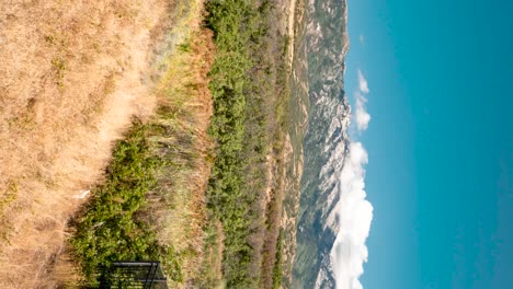 Cloudscape-over-the-Rocky-Mountains-Wasatch-Front-seen-from-Highland,-Utah---vertical-orientation-panoramic-time-lapse