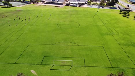 Aerial-View-Flying-Forward-Towards-Football-Pitch,-Perth-Australia