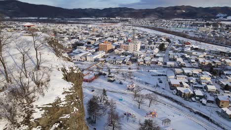 Aerial-view-town-and-city-in-winter-with-snow-in-Hokkaido-island-Japan