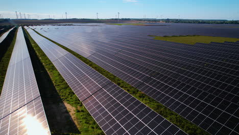 Aerial-drone-shot-over-Ecology-solar-power-station-panels-over-the-fields-for-green-energy-production-at-daytime-in-Poland