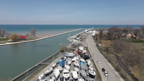 Aerial-View-of-Sailing-Yachts-and-Leisure-Motor-Boats-Out-of-Water-on-Storage-Parking-along-Dock-Quay-at-Port-Dalhousie-Harbor-Marina-Pier-Jetty,-Coastal-Waterfront-off-Season-Nautical-Landscape