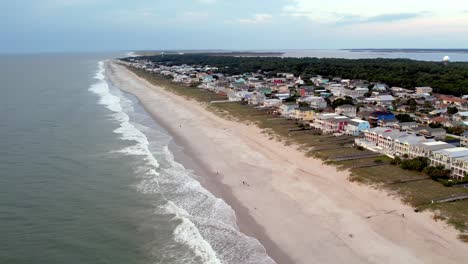 Aerial-slow-pullout-homes-along-the-coast-at-kure-beach-nc,-north-carolina