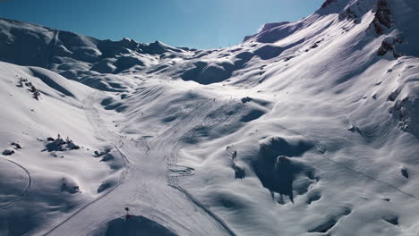 Flyover-looking-down-on-groomed-ski-runs-at-Avoriaz-Ski-Resort-in-French-Alps