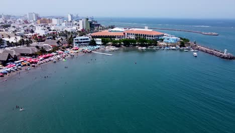 Boca-del-Rio-city-aerial-view,-with-Malecon-and-Aquarium-as-background