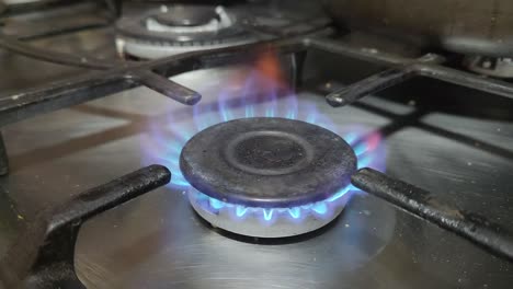 Video-of-a-kitchen-stove-burner-being-turned-on-and-the-flames-are-lit-automatically