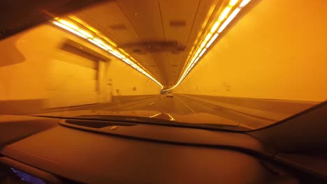 Red-Car-driving-through-a-tunnel