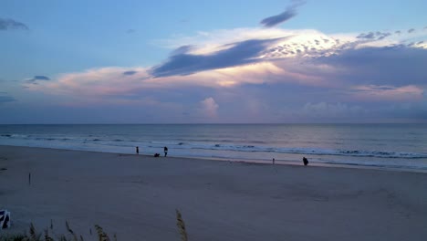Sea-Oats-at-sunset-aerial-flyover-at-Carolina-Beach-NC-near-Wilmington,-NC,-Wrightsville-Beach-and-Kure-Beach