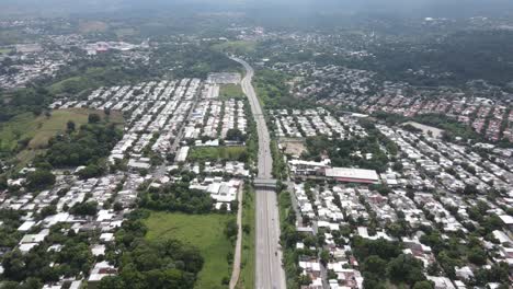 Aerial-view-of-a-highly-populated-area-in-the-vicinity-of-a-highway