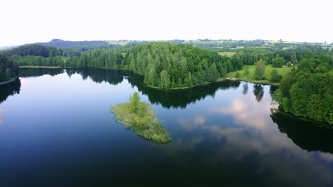 Aerial-lakeview-of-szurpiły-lake-reflecting-the-sky-in-Poland
