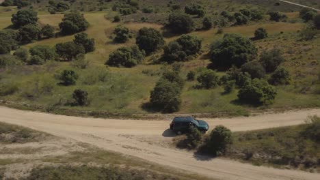 Aerial-shot-of-a-4x4-vehicle-turning-left-in-a-fork