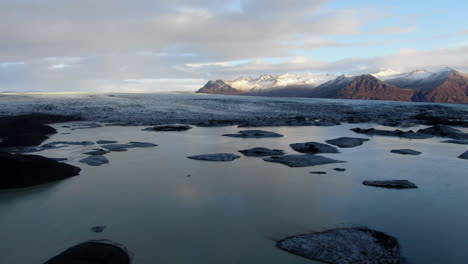 Fantastic-aerial-shot-over-the-haoldukvisl-glacier-and-where-you-can-see-the-beautiful-lake-created-by-the-melting