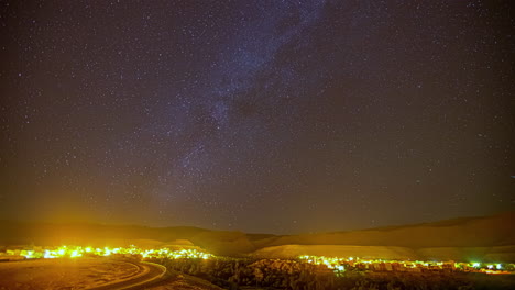 Residential-Town-Illuminated-At-Night-Under-Starry-Sky