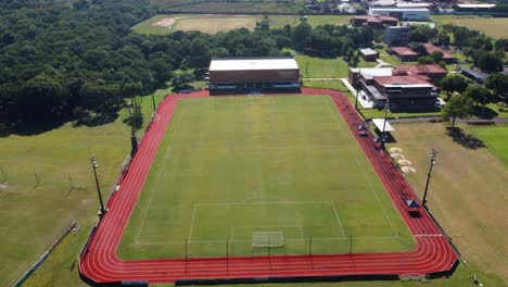 Aerial-View-Of-Unique-High-Performance-Center,-Green-Soccer-Field,-Paraguay