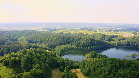 Aerial-view-of-lake-landscape-in-Poland-under-strong-sunlight