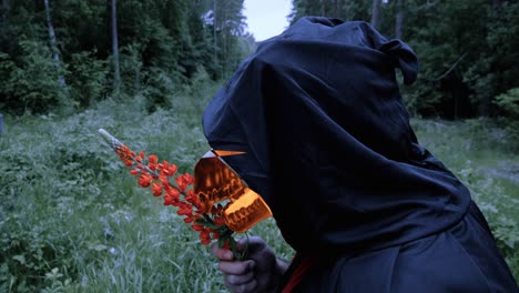 Grim-Reaper-With-Fiery-Animal-Skull-Breathing-Life-To-Lupine-Flower-In-The-Wilderness